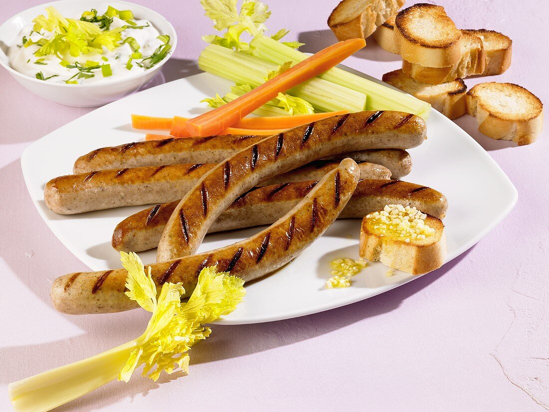 Grilled sausages with celery and carrots