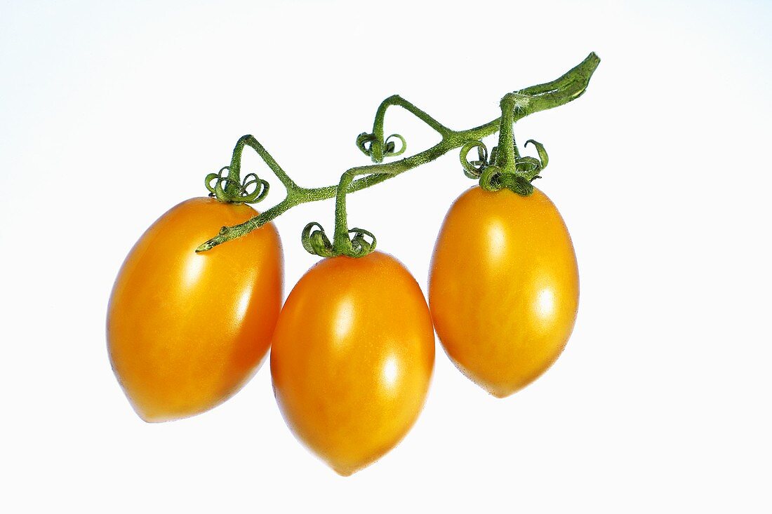 Three yellow tomatoes
