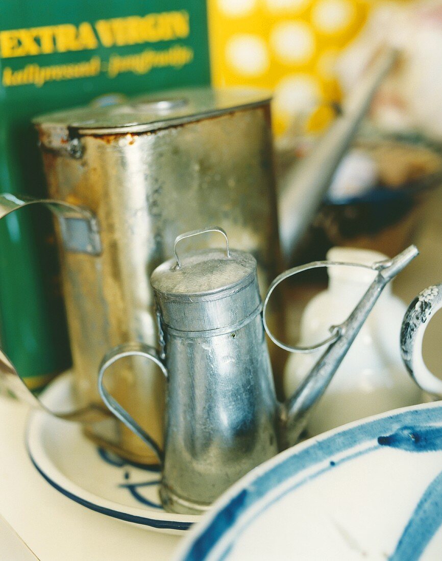 Two metal oil cans