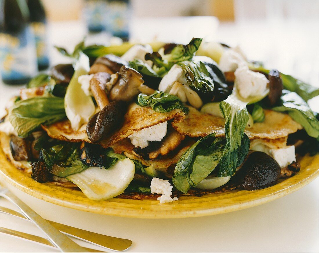 Filled pancakes with goat's cheese, mushrooms & pak choi