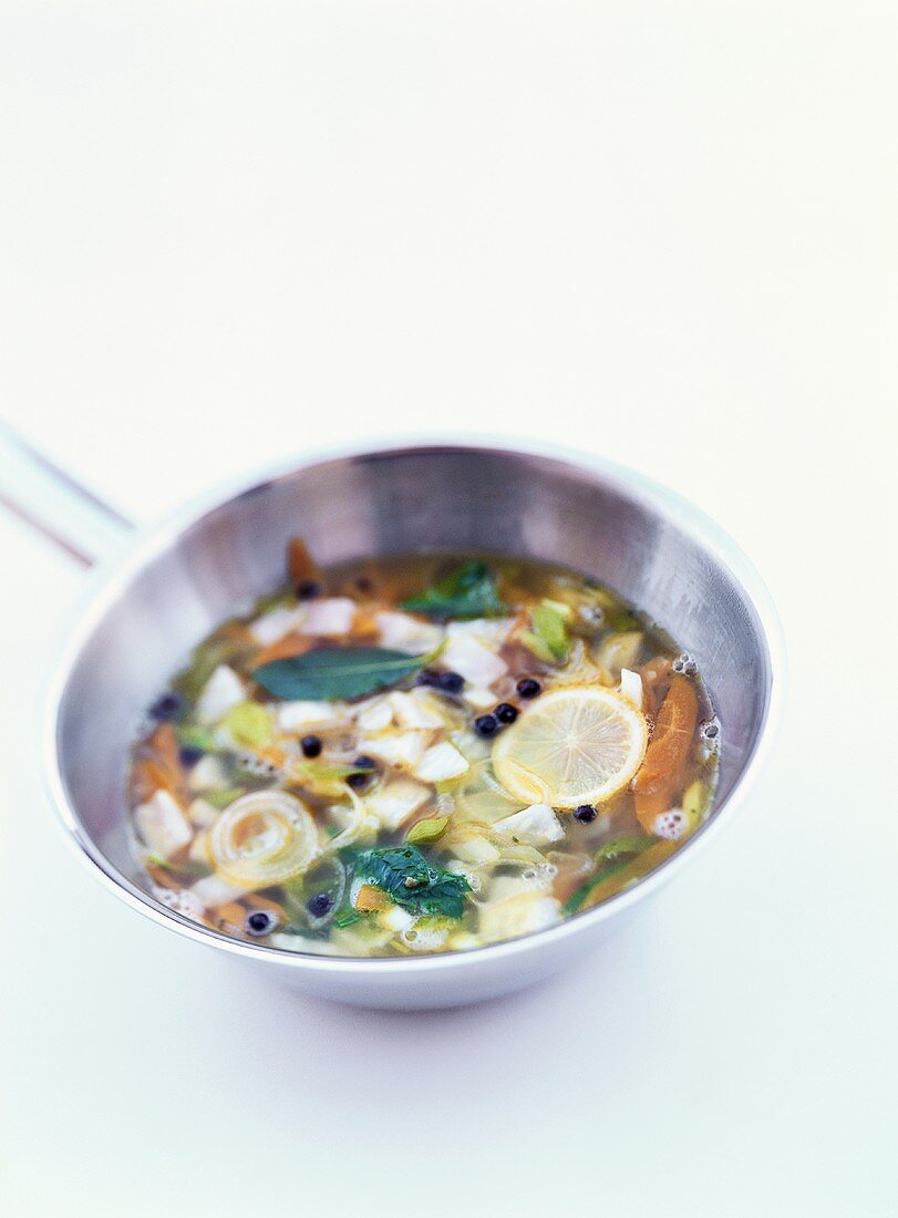 Vegetable stock in stainless steel pan