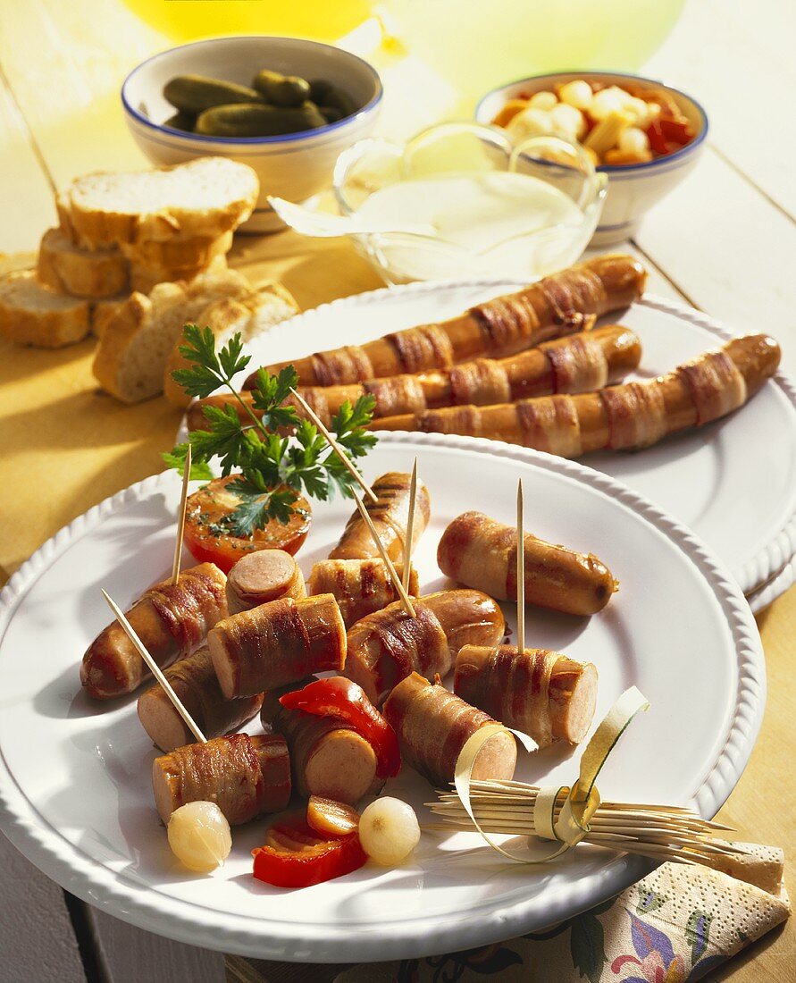 Bacon-wrapped sausages with mustard dip