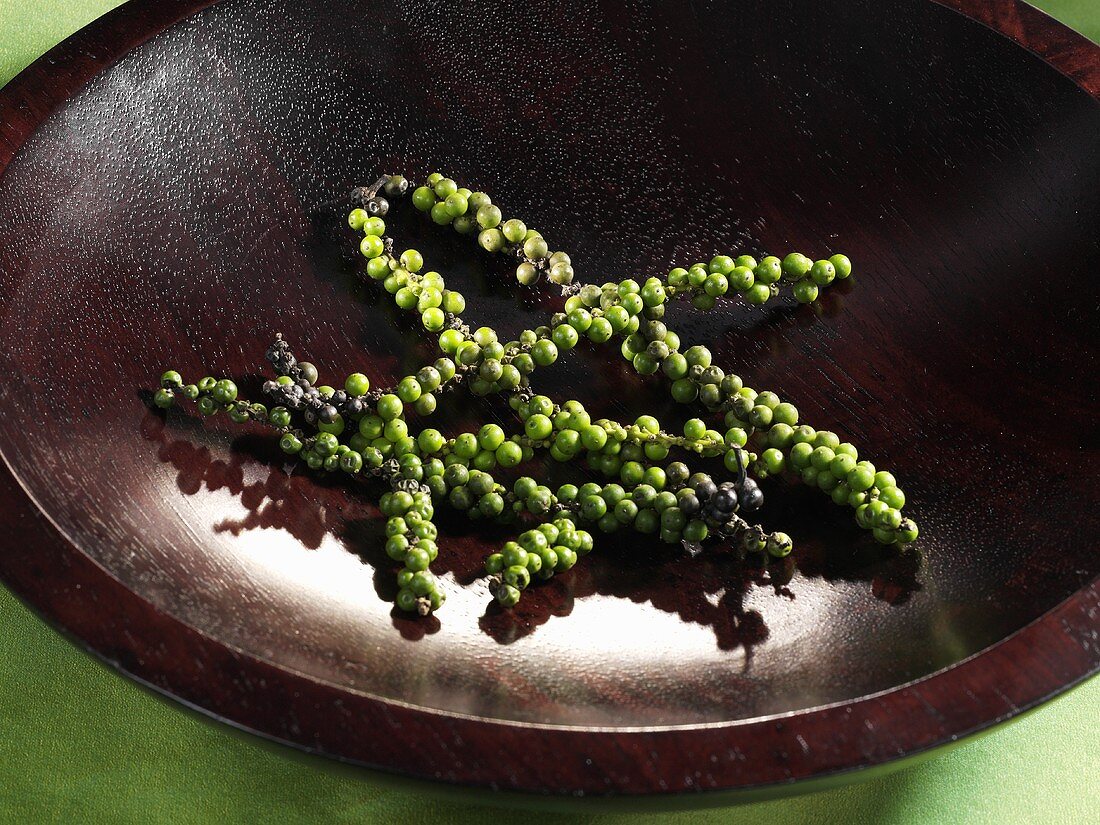 Green pepper in a wooden bowl