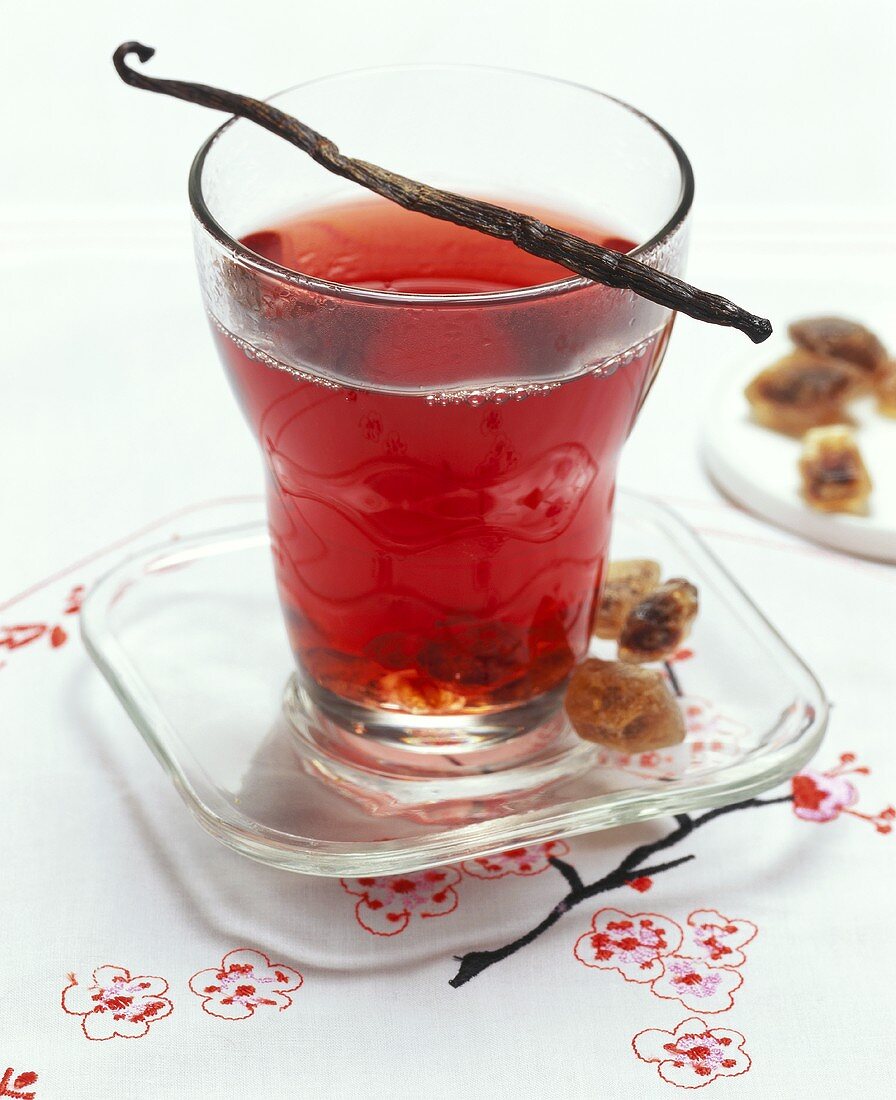 Fruit tea with vanilla pod and brown sugar crystals