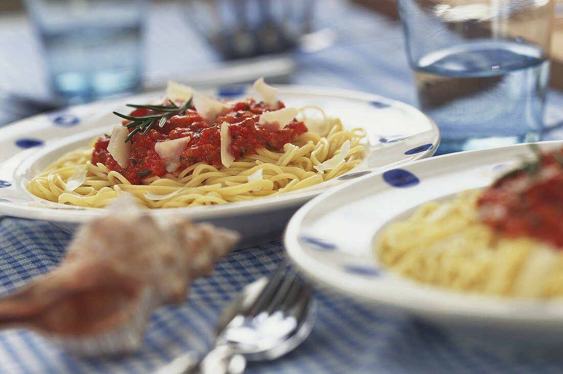 Spaghetti with tomato sauce and fresh rosemary