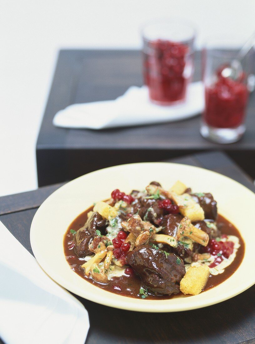 Venison ragout with cranberries & mashed potato with celery