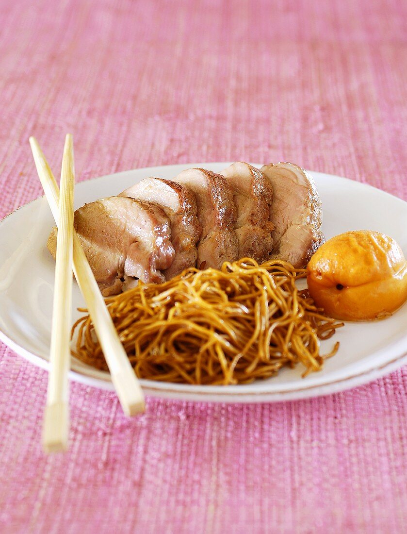 Pork fillet with fried noodles and apricot