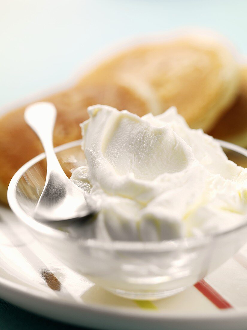 Whipped cream in a glass bowl