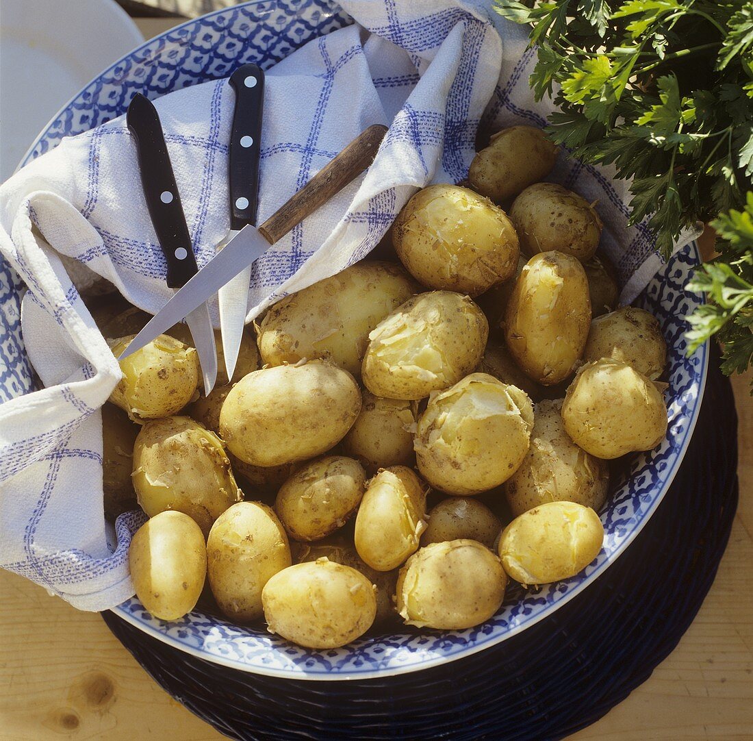 Potatoes cooked in their skins in a bowl