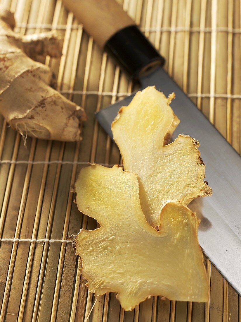 Slices of ginger with knife