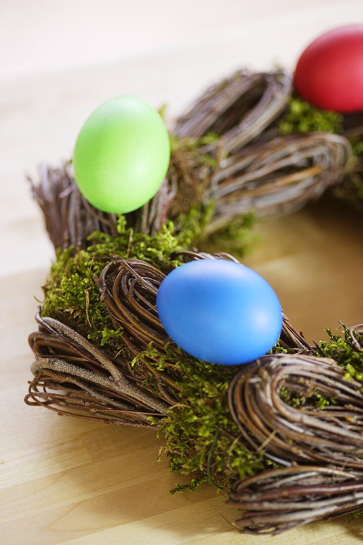 Coloured Easter eggs on willow wreath