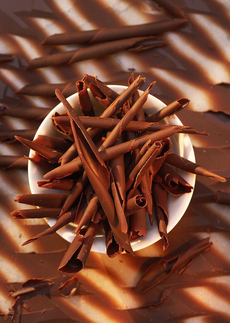 Chocolate curls in a small bowl