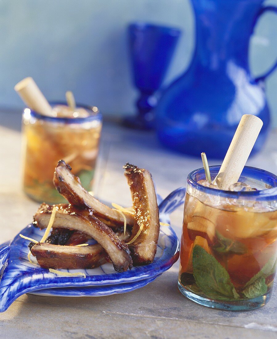 Pork ribs and fruit cocktail with ice