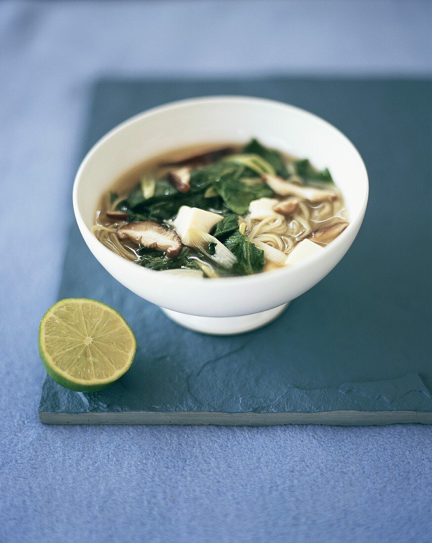 Asian noodle soup with mushrooms and pak choi