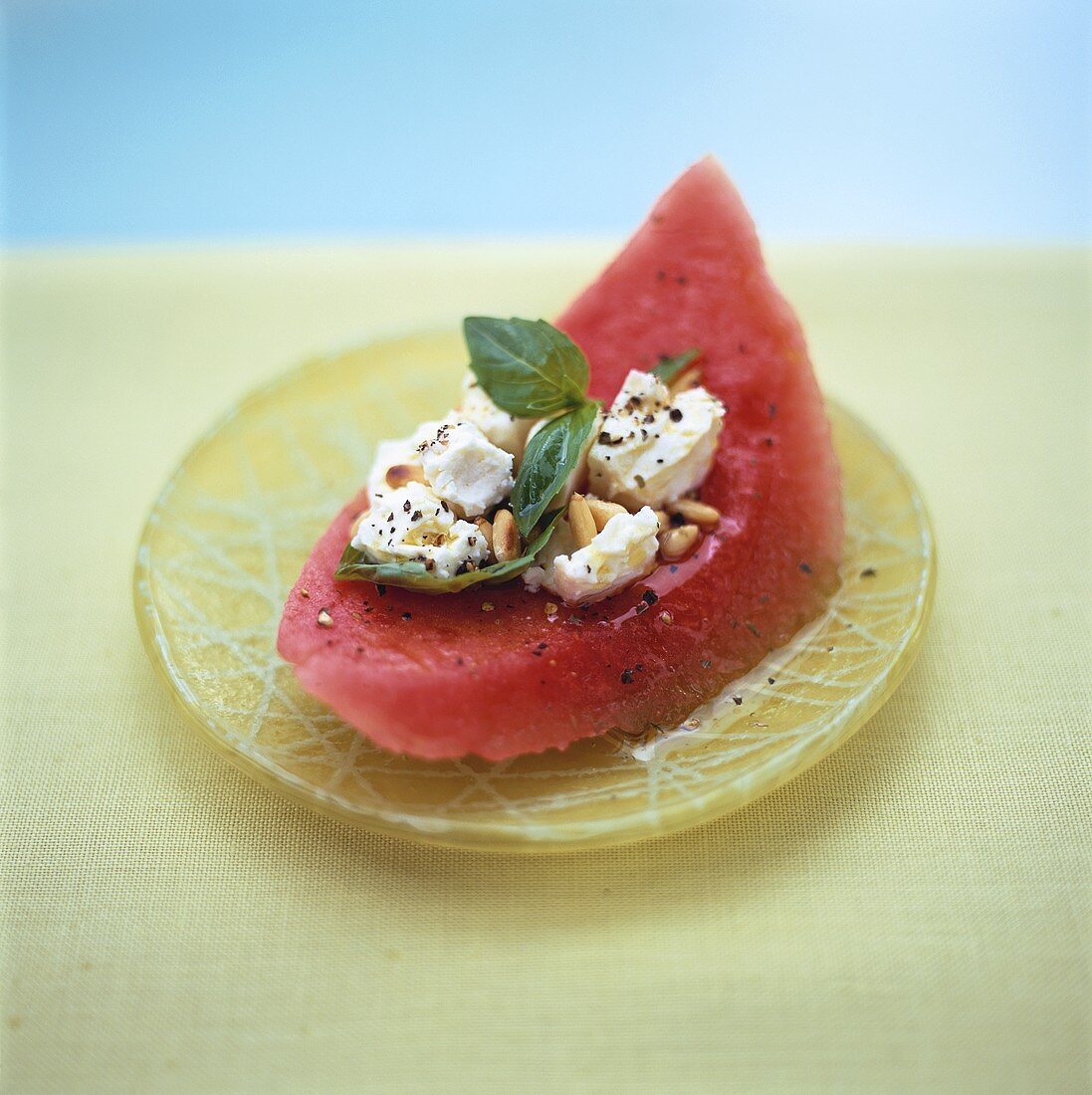 Watermelon with sheep's cheese and pine nuts