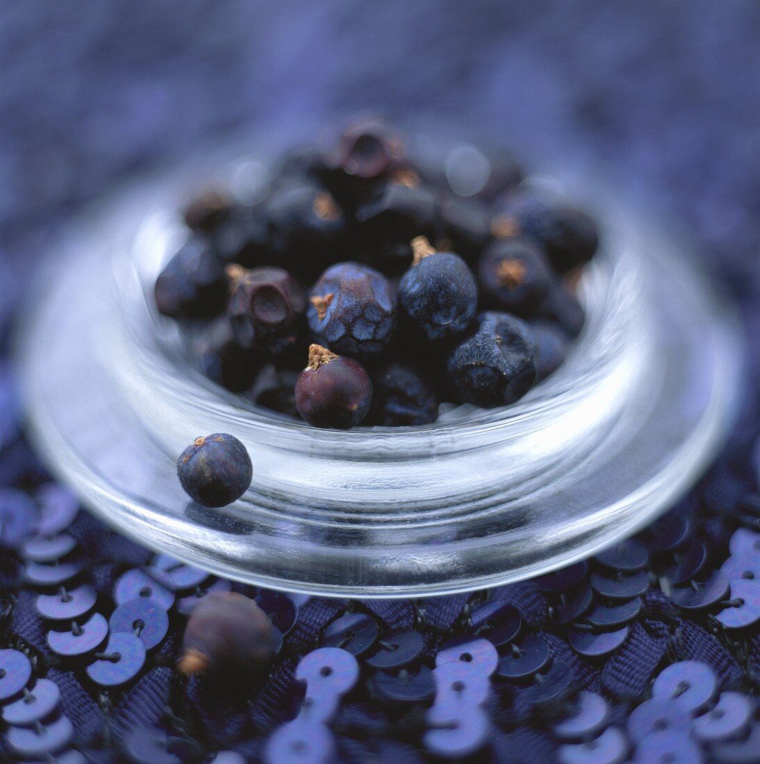 Juniper berries in a small glass bowl