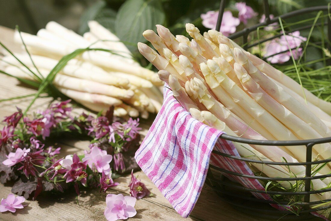 White asparagus in open air with flower wreath