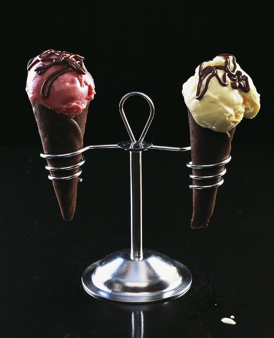 Strawberry ice cream & vanilla ice cream in chocolate cones