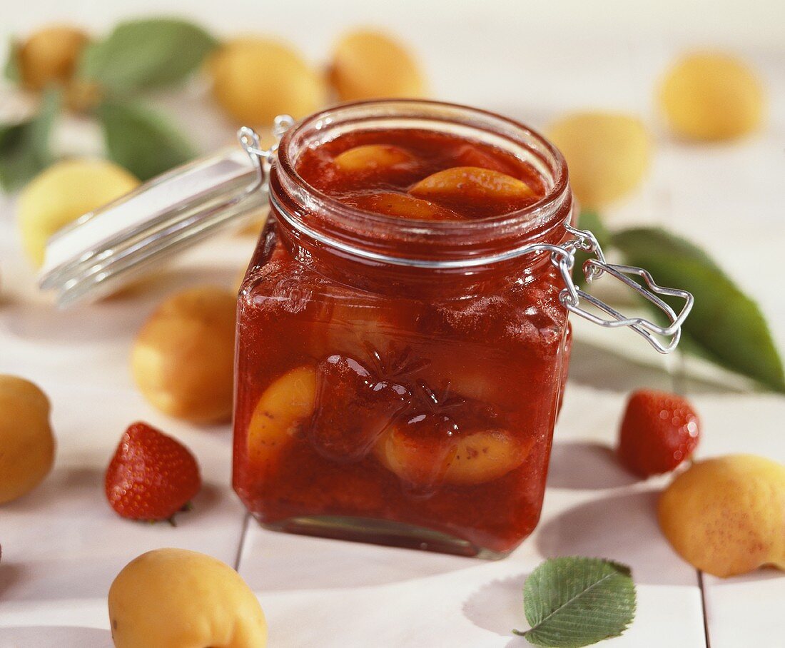 Strawberry and apricot jam in a jar