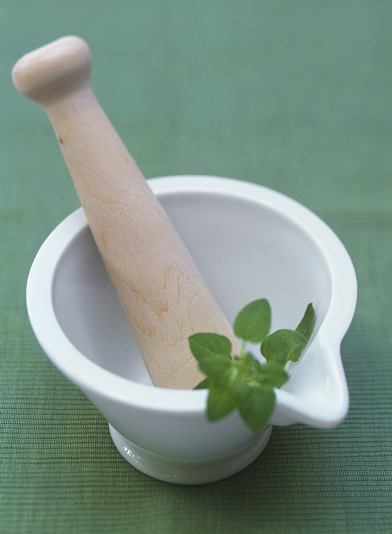 Mortar and pestle with Thai basil