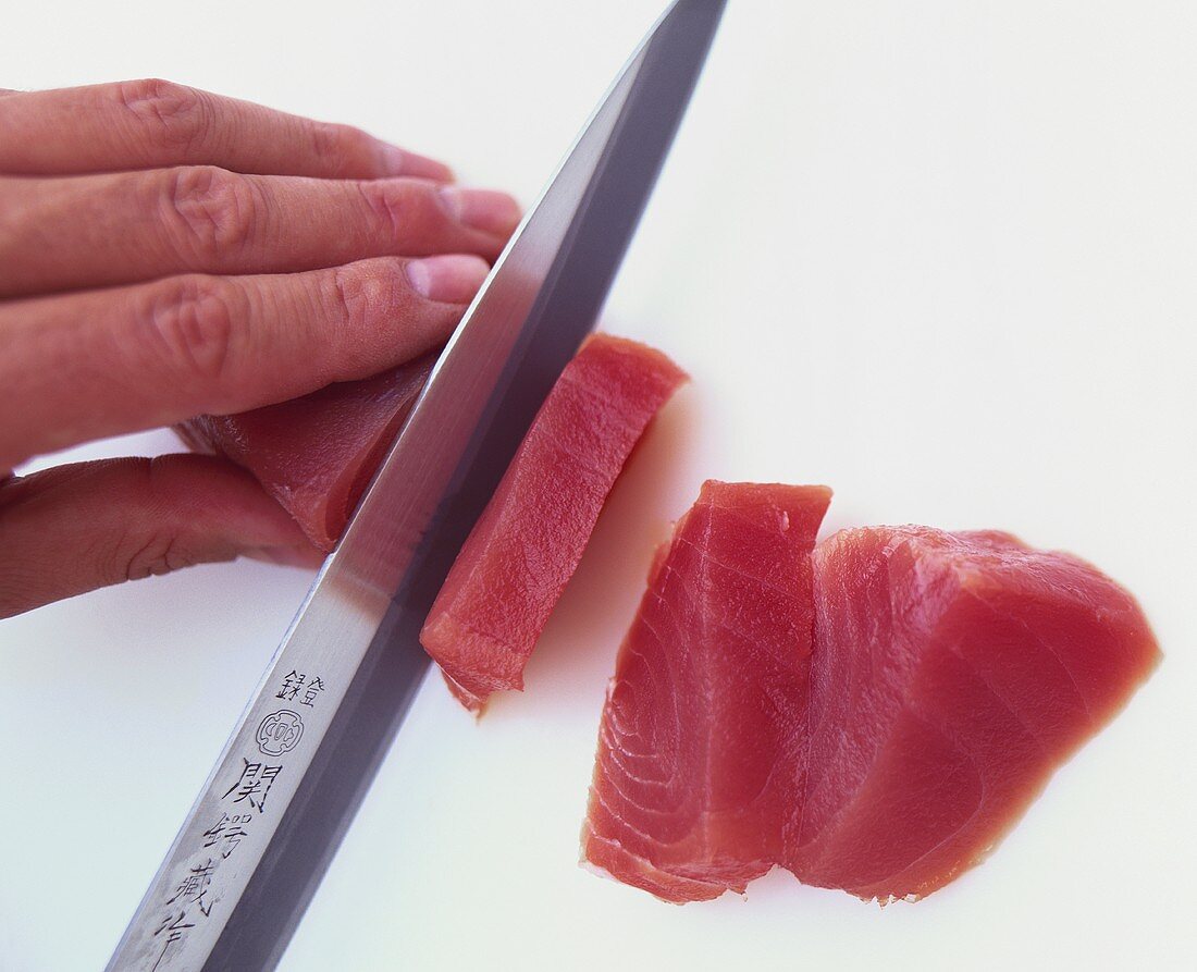 Slicing tuna fillet