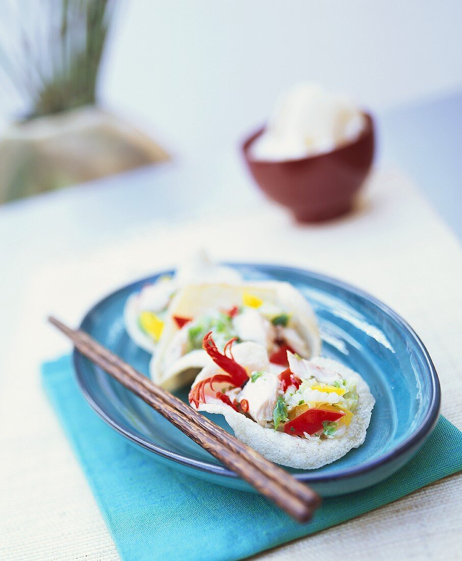 Fish salad with marinated Chinese cabbage in prawn crackers