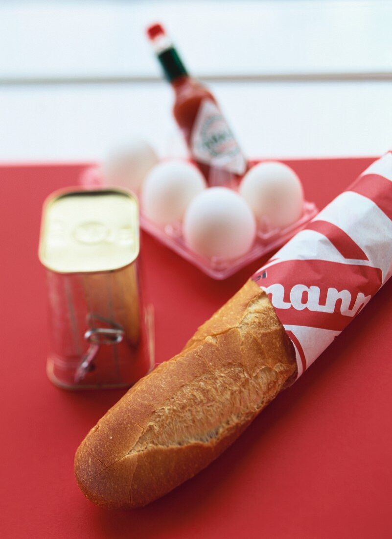 Baguette, tin of corned beef, eggs and tabasco