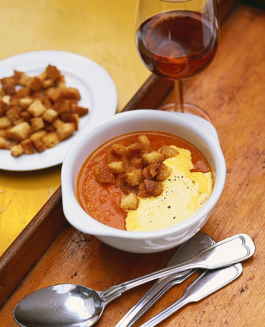 Tomato and fish soup with sauce rouille and croutons