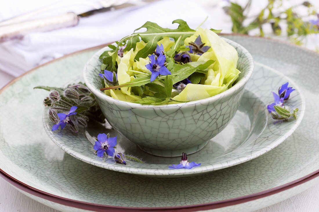 Lettuce hearts with rocket and borage flowers
