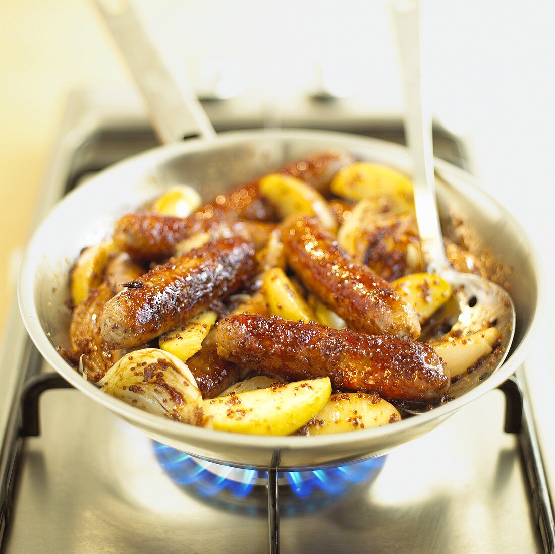 Fried sausages with apple and mustard