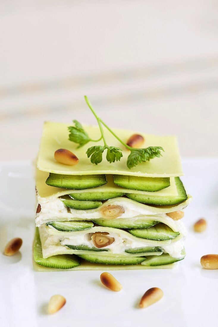 Soft cheese and courgette lasagne with pine nuts