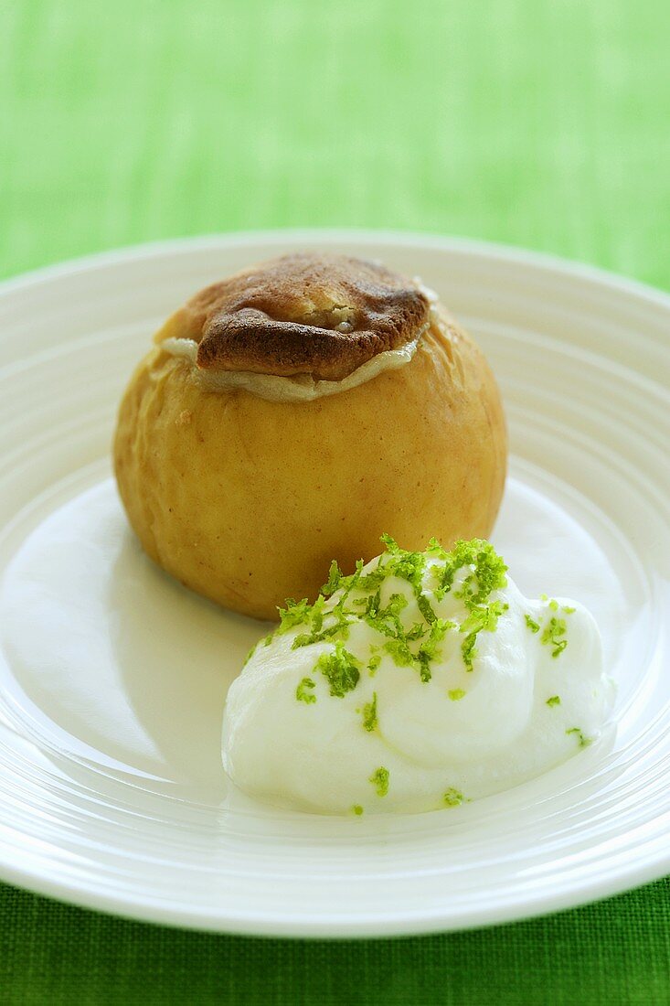 Baked apple with marzipan and whipped cream