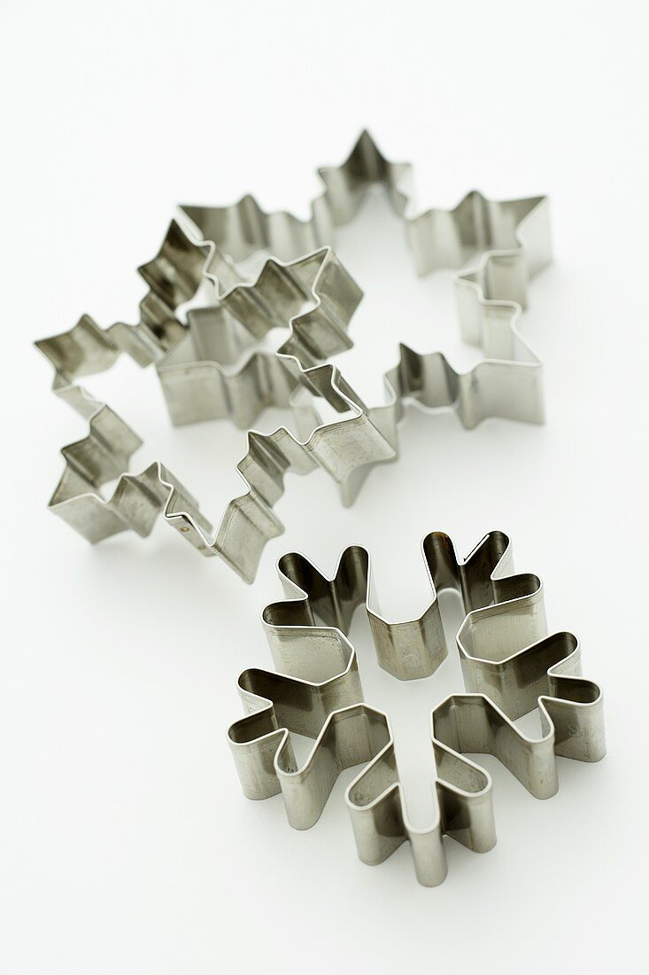 Three snowflake biscuit cutters