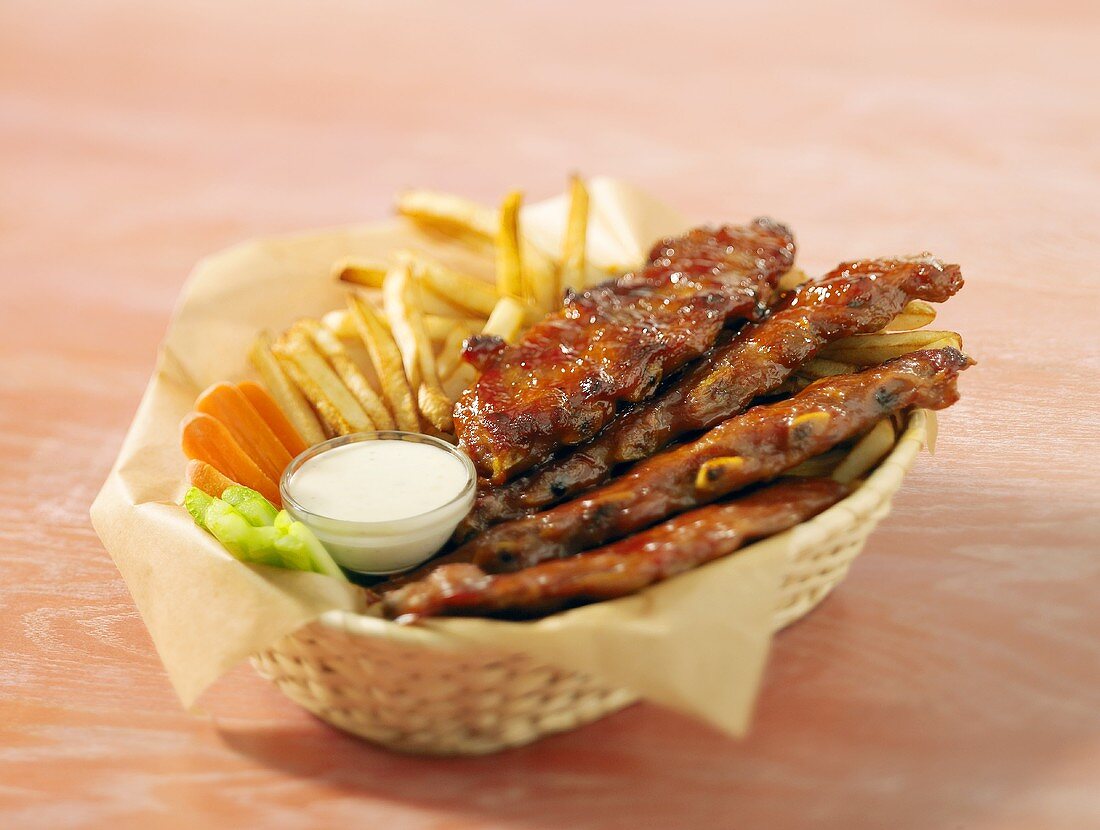 Spare-ribs and chips in a basket