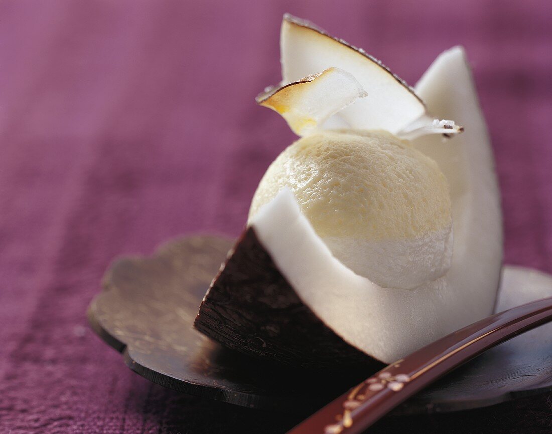 Passion fruit and coconut cream in a wedge of coconut