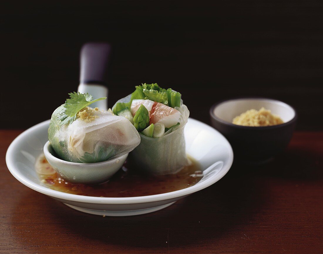 Rice paper rolls filled with giant freshwater prawns, dip
