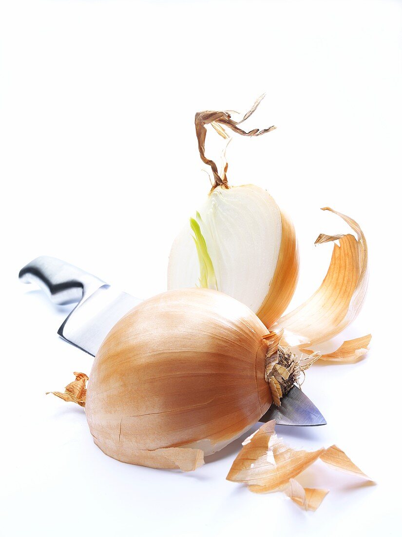 Halved onion with knife