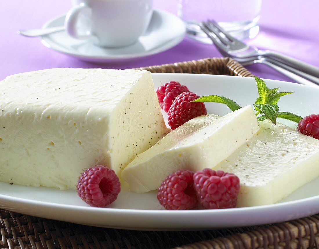 Soft cheese pudding with fresh raspberries