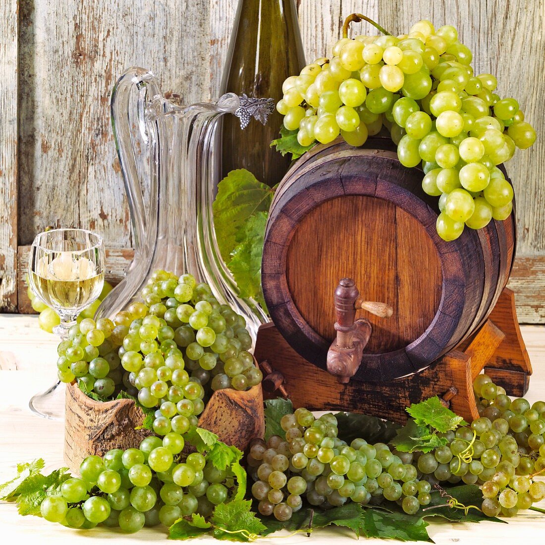 Still life with wine barrel and fresh grapes