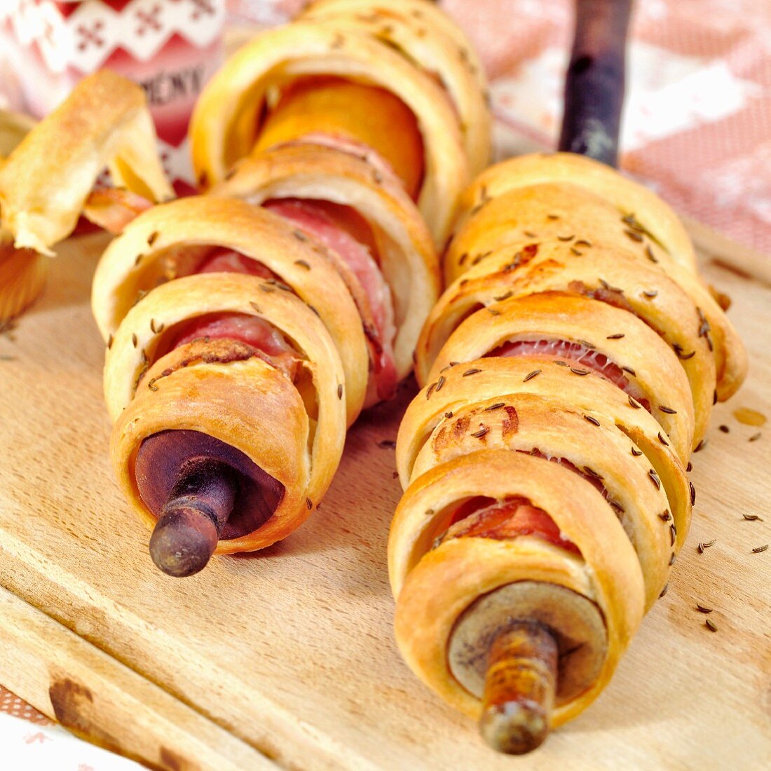 Bread baked on a stick with bacon