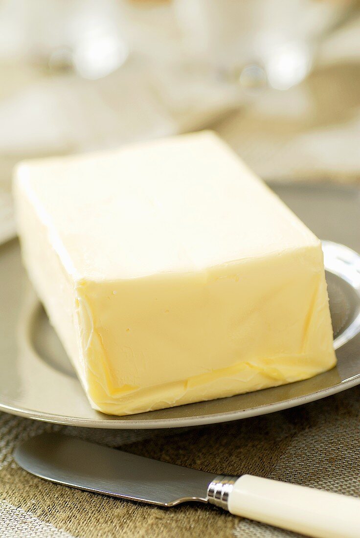A block of butter on a plate