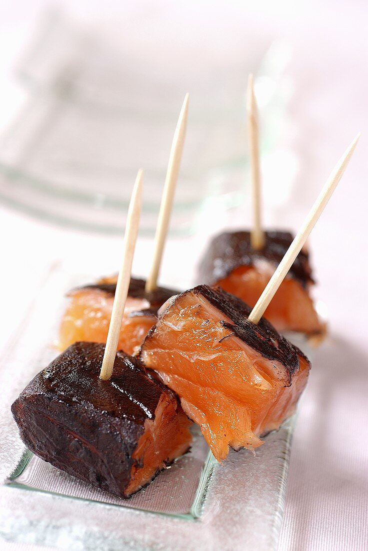 Fried salmon cubes with cuttlefish ink