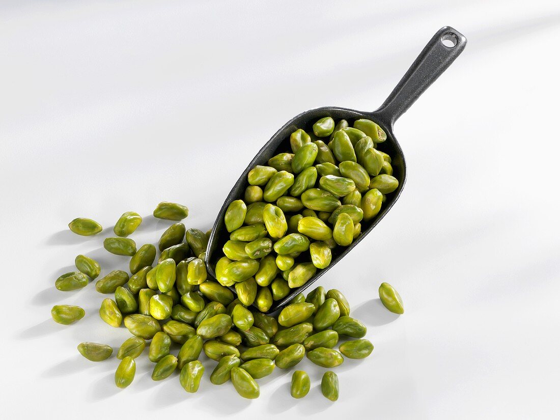 Shelled pistachios with scoop