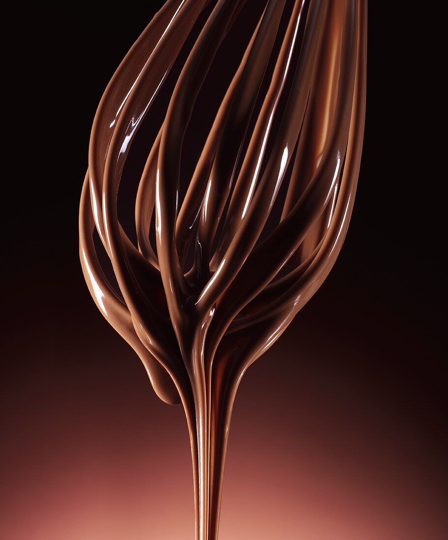Melted chocolate running from a whisk