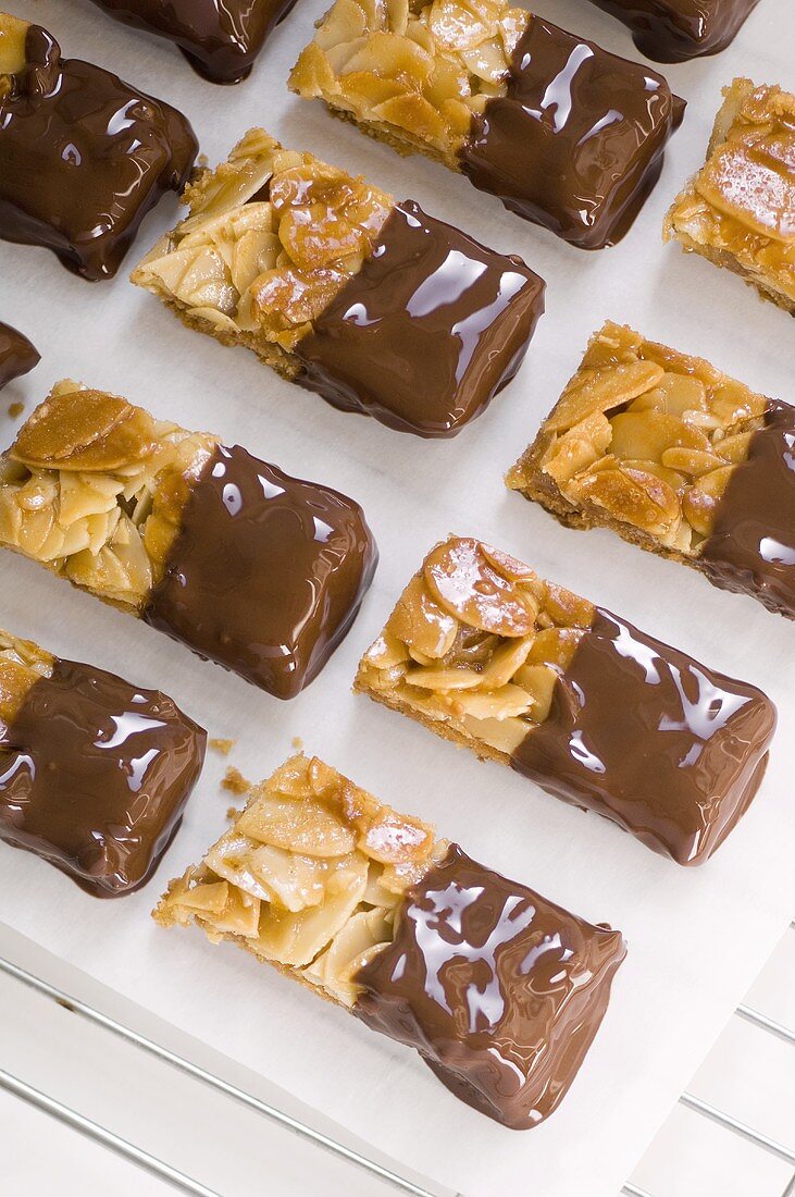 Almond slices half coated in chocolate