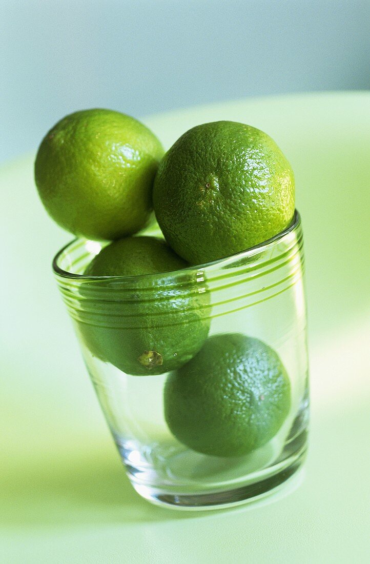 Four limes in a glass