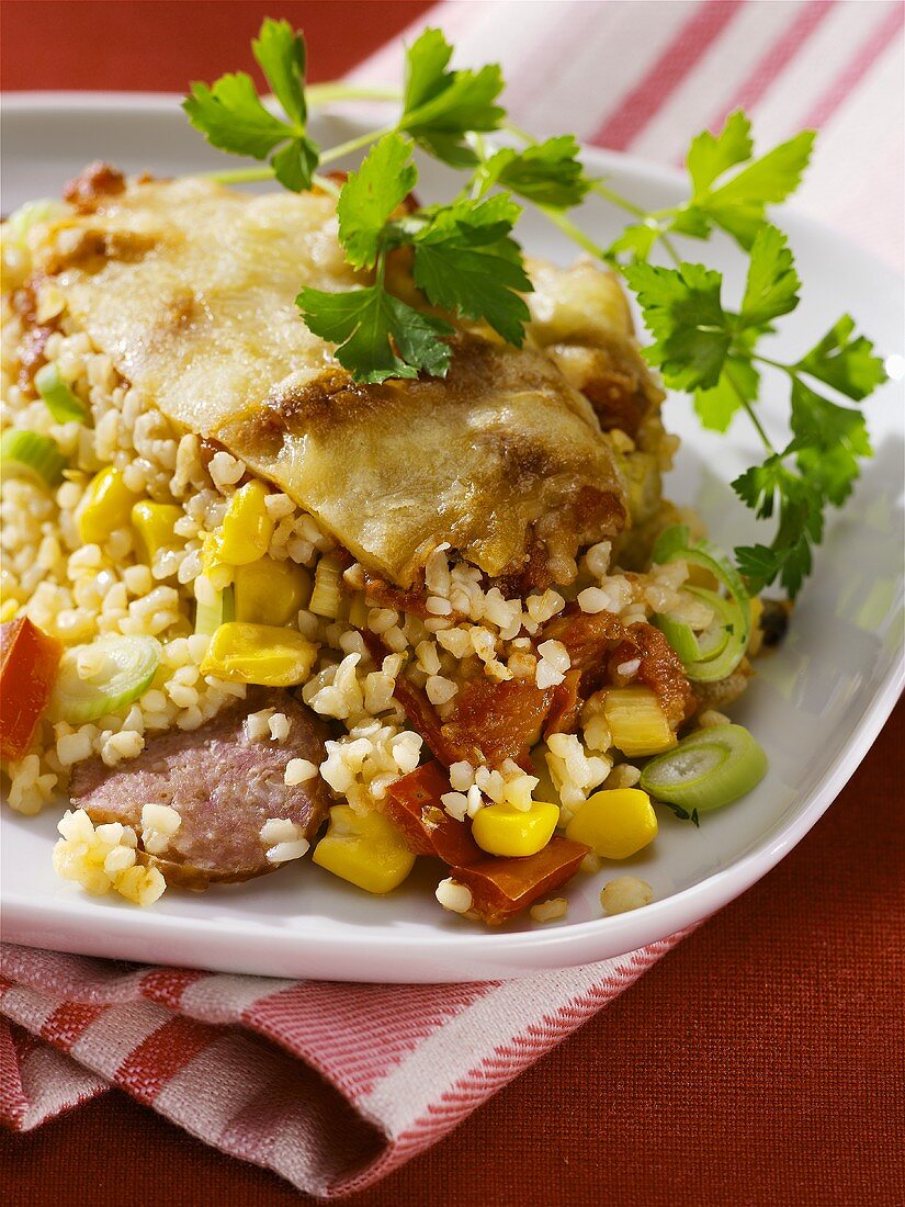 Bulgur wheat and vegetable gratin with cabanossi