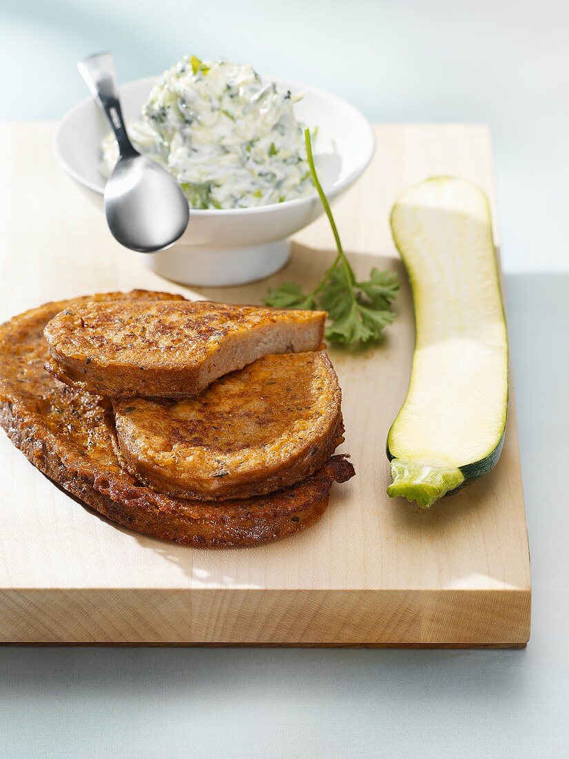 Slices of fried bread with tzatziki