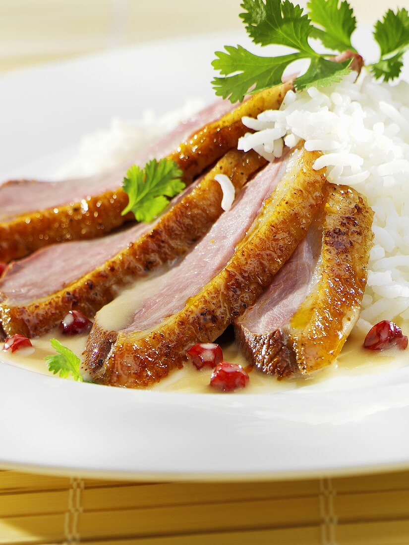 Roast duck breast with coconut sauce and rice