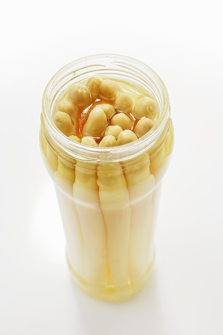 White asparagus in an opened jar